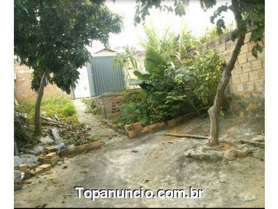 Meio lote com casa