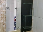 Farmácia de banheiro com detalhe em espelho e suporte