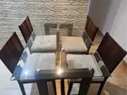 mesa de jantar de vidro com 4 cadeiras