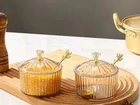 Açucareiro de acrílico acompanha uma colher de aço inoxidável dourado